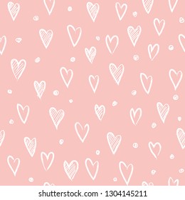 Hand-drawn doodle seamless pattern with hearts and dots. Design elements for Valentine's day. Rose background.