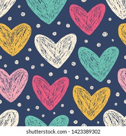 Hand-drawn doodle seamless pattern with hearts. Design elements for Valentine's day. Dark navy color background and multicolor elements.
