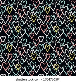 Hand-drawn doodle seamless pattern with hearts. Vector illustration. Black background.