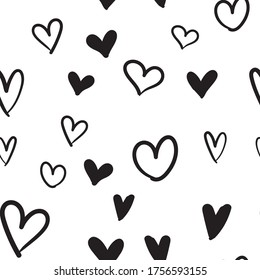 Hand-drawn doodle seamless pattern with hearts. Valentine's day background. Heart doodles texture.
