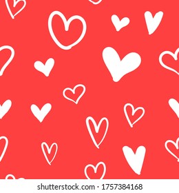 Hand-drawn doodle seamless pattern with hearts. Valentine's day background. Heart doodles texture.
