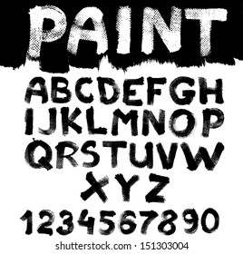 Hand-drawn font on textured paper with paint strokes