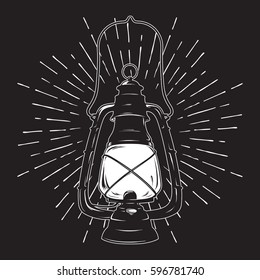 Hand-drawn grunge sketch vintage oil lantern or kerosene lamp with rays of light. T-shirt print or poster design. Vector illustration.