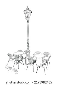 Hand-drawn illustration of a Fragment of a Street cafe with a street lamp in the old city, detailed pencil drawing. Design element, postcard, t-shirt design