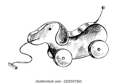 A hand-drawn ink sketch of  a wooden toy dog on wheels. Outline on a white background, vintage vector illustration.   Vintage sketch element for labels, packaging and cards design.