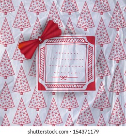 Hand-drawn label and paper bow on patterned background with fir trees covered with snow  and old crumpled paper texture, Christmas background