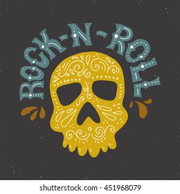 Handdrawn lettering with skull and rock-n-roll sign. Vector typography. Design of a t-shirt, bag or other apparel. Illustration for rock concert.