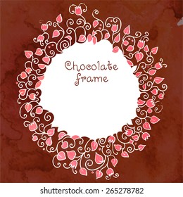 Hand-drawn round frame made of pink leaves, flowers and branches on dark brown chocolate background. Vector design.