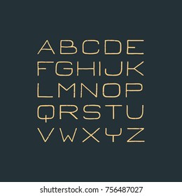 Handdrawn sans serif font. Handmade latin alphabet. Square yellow letters on dark backdrop.