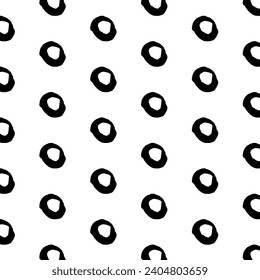 A hand-drawn, seamless, black and white pattern featuring a grid of grunge circles. This edgy design adds a contemporary touch, suitable for textiles, posters, cards, and various creative projects