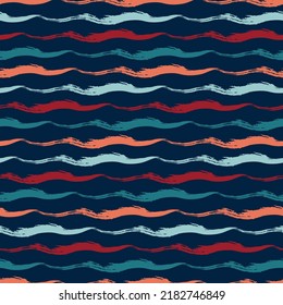 Hand-drawn seamless geometric pattern with colorful grunge texture. Multi-colored wavy stripes on dark blue background. Vector background for printing on fabric, gift wrapping, covers, wallpapers.