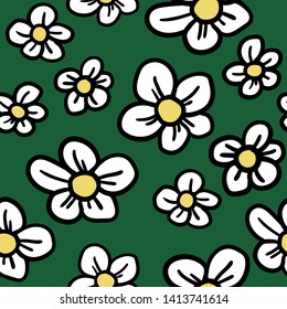 Hand-drawn seamless pattern of strawberry flowers or camomiles on green background. Stylized cartoon doodle.