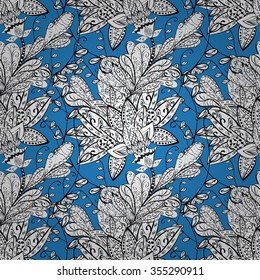 Hand-drawn seamless vector zentangle pattern in white, black, blue. Doodle style. Isolated background. Tribal ethnic design. Could be used as print for textile, paper or web background.