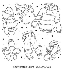 Hand-drawn set of winter cloth and essentials doodle coloring