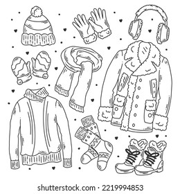 Hand-drawn set of winter clothes and essentials doodle coloring