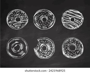 A hand-drawn sketch of a set of donuts. Top view. Vintage illustration on chalkboard background. Pastry sweets, dessert. Element for the design of labels, packaging and postcards.