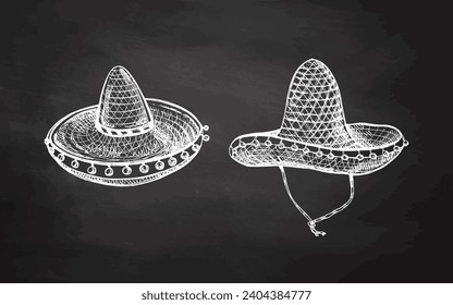 Hand-drawn sombrero sketches set on chalkboard background. Vintage drawing of hat. Vector black ink outline illustration. Mexican culture, clothes, Latin America.