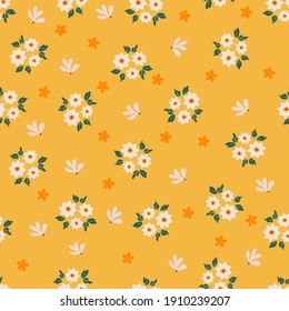 Hand-drawn spring flower on yellow background seamless pattern