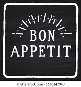 Hand-drawn text on a blackboard "bon appetite"