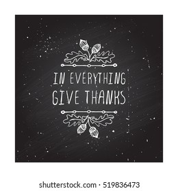 Handdrawn thanksgiving label with acorns and text on chalkboard background. In everything give thanks.