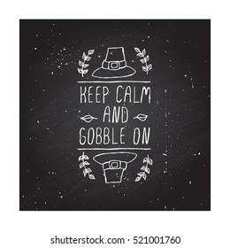 Handdrawn thanksgiving label with pilgrim hat and text on chalkboard background. Keep calm and gobble on.