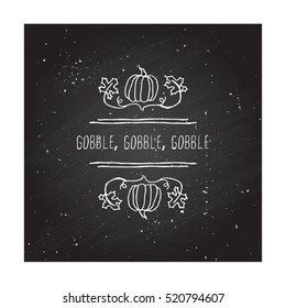 Handdrawn thanksgiving label with pumpkins, maple leaves and text on chalkboard background. Gobble, gobble, gobble.