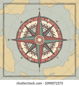 Hand-drawn vector banner with a wind rose and old nautical compass in retro style. Illustration on the theme of travel and discovery on the background of old map