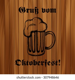 Hand-drawn vector illustration of a mug of beer. Traditional Oktoberfest drink on wooden background. Oktoberfest celebration design, eps10.
Text in German: "Greetings from Oktoberfest!"