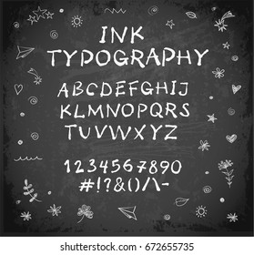 Hand-drawn vector ink sketch font on blackboard background.