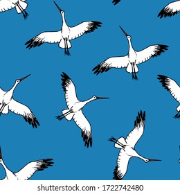 Hand-drawn vector seamless pattern. White stork flying in the sky on a bright blue background. Wild birds, animal, nature. For prints of children's clothing, fabric, packaging, textile products.
