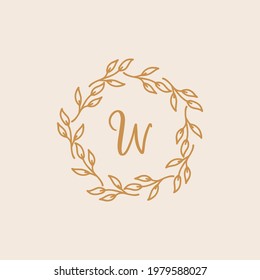Hand-drawn wreath logo. Botanical label for packaging. Herbal wreath emblem wedding design.
