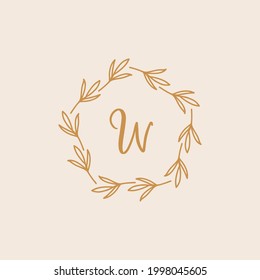 Hand-drawn wreath logo. Botanical label for packaging. Herbal wreath emblem wedding design.