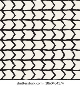 Hand-drawn zig-zag lines geometric seamless pattern. Monochrome black and white ink strokes. Abstract vector background texture.