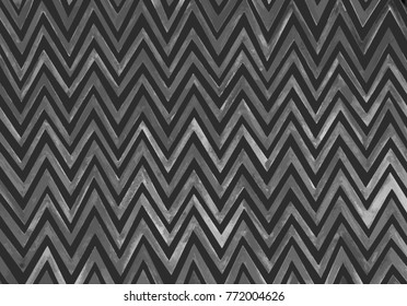 Hand-drawn zigzag pattern and traced into a vector of gray hues, an illustration of a beautiful monochrome background.