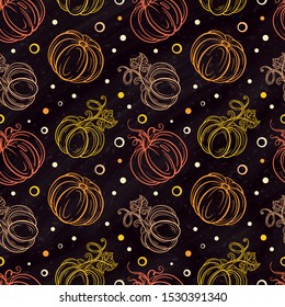 Hand-drown colorful vector pumpkins and maple leaves seamless pattern on a chalkboard background.