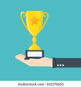 Handing awards concept. Man holding a reward for awarding. Recognition, bonus, gift. Cup