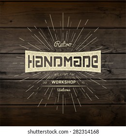 Handmade badges logos and labels for any use, on wooden background texture