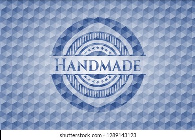 Handmade blue badge with geometric pattern.