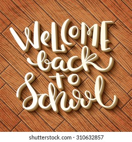 Hand-made calligraphy Welcome back to school over wooden background. Vector illustration