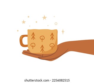 Handmade ceramic cup in a hand isolated on white. Woman holding a mug with hot drink concept