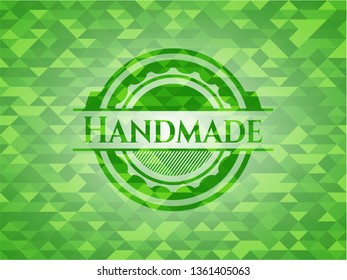 Handmade green emblem with triangle mosaic background