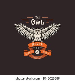 Handmade owl and ribbon. Fashion apparel print. T shirt graphic vintage grunge vector illustration badge label logo template. Hand crafted drawn design. Painted lettering type on dark background.