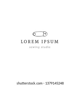 Handmade theme. Hand drawn vector logo template with a safety pin. Isolated illustration. For business identity and branding, for authors of handicraft products.