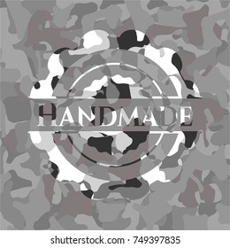 Handmade written on a grey camouflage texture