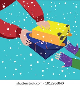 Hands of an adult holding Christmas presents and children's hands reaching for them