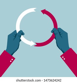 Hands assemble an arrow symbol. Isolated on blue background.