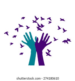 Hands and birds.Silhouette of the human hand, which releases the birds and the birds flies