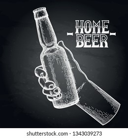 Hands with bottle of beer drawn in engraving technique. Graphic illustration isolated on the chalkboard
