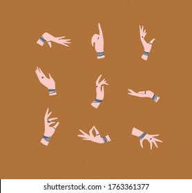 Manos con brazaletes y anillos de estilo étnico en diferentes posiciones para expresar sentimientos y emociones dibujando sobre fondo mostaza