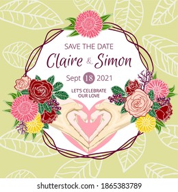 Hands of bride and groom forming a heart shape covered by flowers on a Wedding Invitation Card